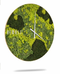 Een Mos klok BEMOSS® ORTHO LIME met de merknaam "BEMOSS" op de voorkant. De wijzerplaat is bedekt met groen en geel mos, waardoor deze een natuurlijk, gestructureerd uiterlijk krijgt, zoals een moswand. De klok heeft witte wijzers die de tijd aangeven, zonder zichtbare cijfers.